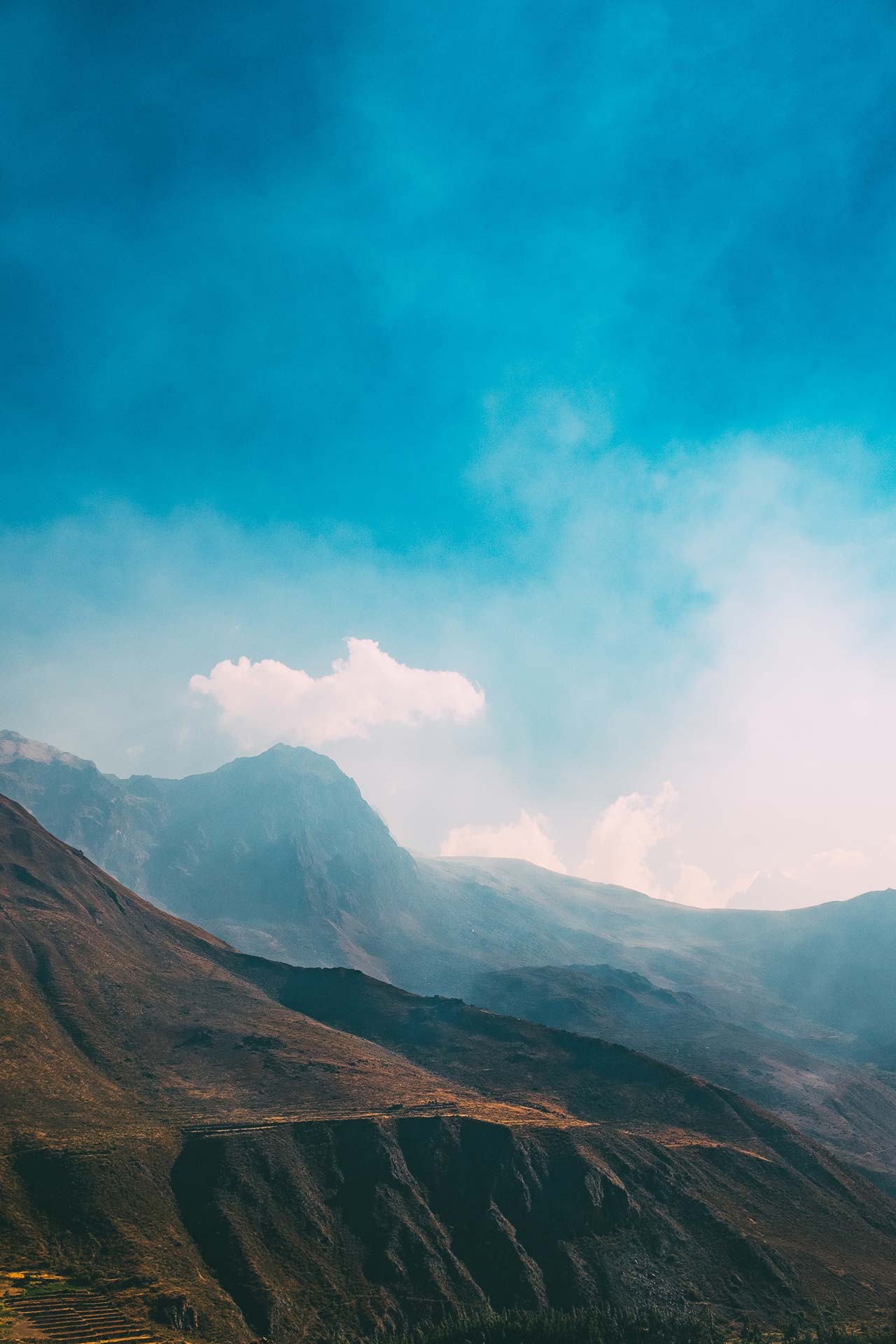 A mountain range with clouds in the sky.