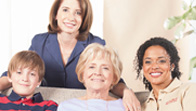 A group of women sitting on top of a couch.