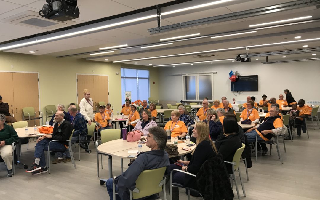 Inside image of an office with so many people sitting