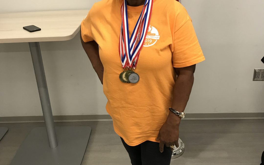Close up image of a lady wearing so many medals